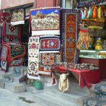 Tibet: Lhasa Outside Jokhang can be seen secular buildings and shops.