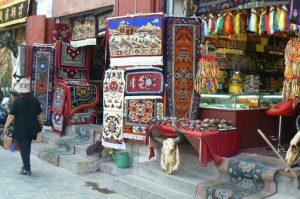 Tibet: Lhasa Outside Jokhang can be seen secular buildings and shops.