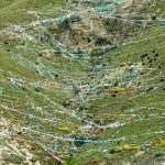 Tibet: Lhasa - Pabonka Monastery.  Above the monastery are very