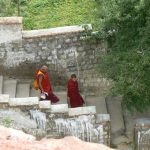 Tibet: Lhasa - Pabonka Monastery.  Two monks before or after