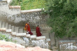 Tibet: Lhasa - Pabonka Monastery.  Two monks before or after