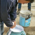 Tibet: Lhasa - Pabonka Monastery.  Milk is added to the