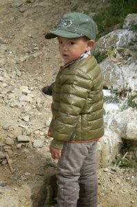 Tibet: Lhasa - Pabonka Monastery.  Child of one of the