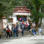 Tibet: Lhasa - Sera Monastery.  Tourists entering the debate