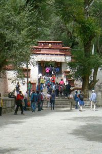 Tibet: Lhasa - Sera Monastery.  Tourists entering the debate