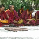 Tibet: Lhasa - Sera Monastery. Younger monks waiting for the debate