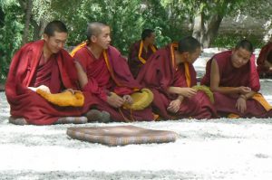 Tibet: Lhasa - Sera Monastery. Younger monks waiting for the debate