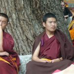 Tibet: Lhasa - Sera Monastery. Facial reactions range from contemplative to