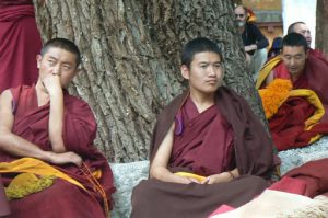 Tibet: Lhasa - Sera Monastery. Facial reactions range from contemplative to