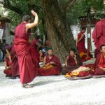 Tibet: Lhasa - Sera Monastery. The courtyard buzzes with the noise