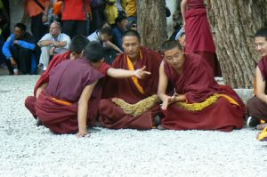 Tibet: Lhasa - Sera Monastery. Making a point of argument  emphasized