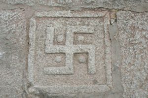 Tibet: Lhasa - Sera Monastery. A swastika carved into a stone