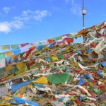 Tibet - prayer flags on a hilltop