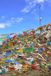 Tibet - prayer flags on a hilltop