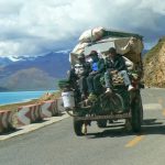 Tibet - a family on the move beside Yamdrok Lake.
