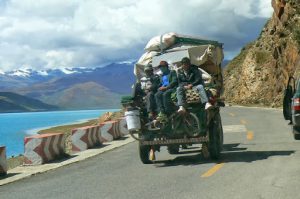Tibet - a family on the move beside Yamdrok Lake.