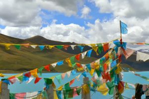 Tibet - prayer flags at Yamdrok Lake.