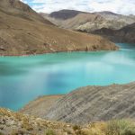 Tibet - a man-made dammed lake shimmers with a surreal