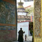 Tibet - a monk walks through Palcho Monastery in Gyantse.