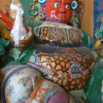 Tibet - a protector warrior at a monastery  entrance to