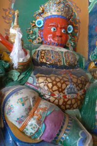 Tibet - a protector warrior at a monastery  entrance to