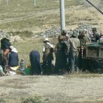 Tibet - farmers getting ready to go home after