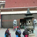 Tibet - pilgrims outside Sakya Monastery