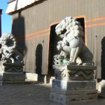 Tibet - mythological protective lions at entry to Sakya