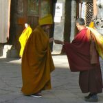 Tibet - monks leaving morning chant at Sakya Monastery.