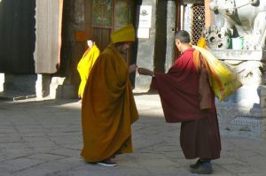 Tibet - monks leaving morning chant at Sakya Monastery.