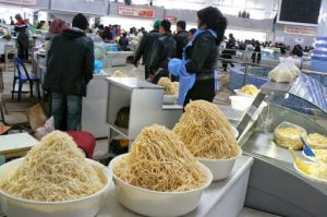 Uzbekistan - Tashkent:  noodle vendors at the Mirobod Market.