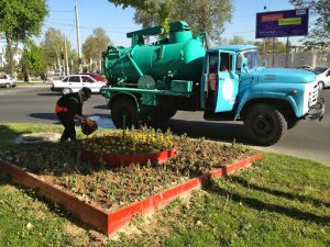 Uzbekistan - Tashkent:  watering the public gardens in central city.