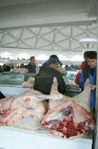 Uzbekistan - Tashkent:  butchers in Chorsu market.