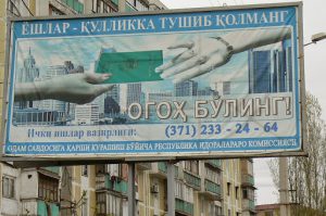 Uzbekistan - Tashkent:  billboard warning people not to give their