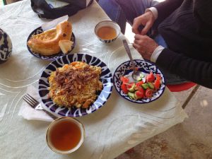 Uzbekistan: Tashkent A serving of 'plov' with round bread (non),  tea