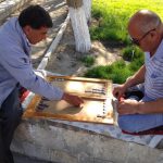 Uzbekistan: Bukhara playing bckgammon in central park; backgammon is one of the