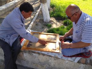 Uzbekistan: Bukhara playing bckgammon in central park; backgammon is one of the