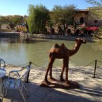 Uzbekistan: Bukhara the central park pond with metal camel statue and