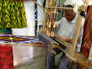 Uzbekistan: Bukhara Sayfiddin silk weaver's shop.