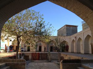 Uzbekistan: Bukhara Sayfiddin courtyard????where camels were watered.; ????it now????houses craft shops