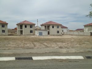 Uzbekistan: Khiva On the road from Bukhara to Khiva; more government-built houses.