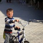 Uzbekistan: Khiva local boy with his bike.