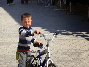 Uzbekistan: Khiva local boy with his bike.