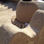 Uzbekistan: Khiva mud and straw urn and walls.