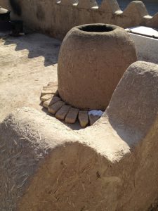 Uzbekistan: Khiva mud and straw urn and walls.