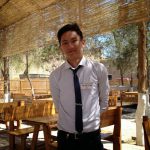 Uzbekistan: Khiva Handsome waiter Maksim at the Kheivak Melika Hotel outdoor