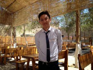 Uzbekistan: Khiva Handsome waiter Maksim at the Kheivak Melika Hotel outdoor