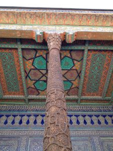 Uzbekistan: Khiva Colored ceiling, glazed tile wall and carved pillar of