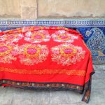 Uzbekistan: Khiva Glazed tiling and a crocheted cover at the Tosh