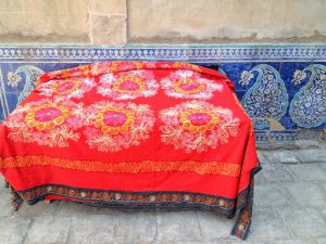 Uzbekistan: Khiva Glazed tiling and a crocheted cover at the Tosh